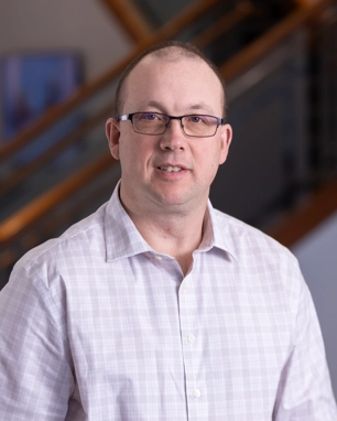 portrait of a smiling man in professional attire